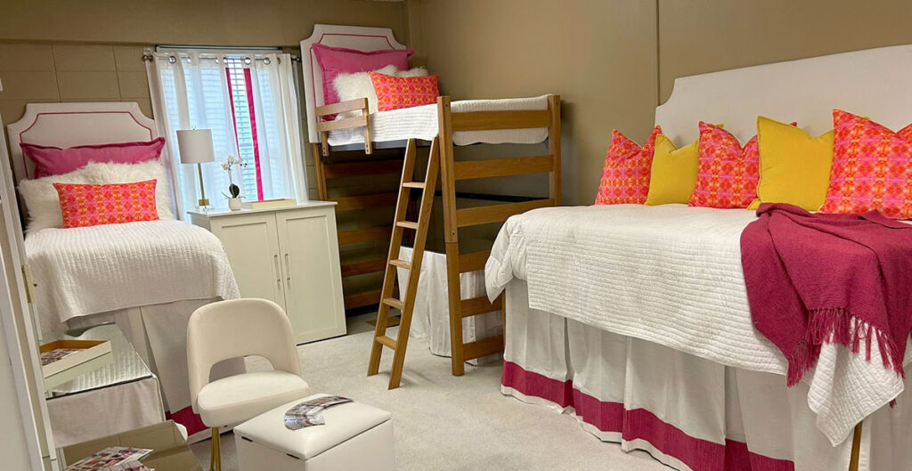 View of dorm room with attractive arrangement of loft beds